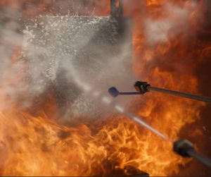 AFEX Liquid Fire Suppression System Discharging to Suppress a Fire