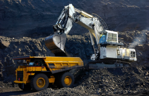 An excavator and haul truck excavating the earth in the asia-pacific region